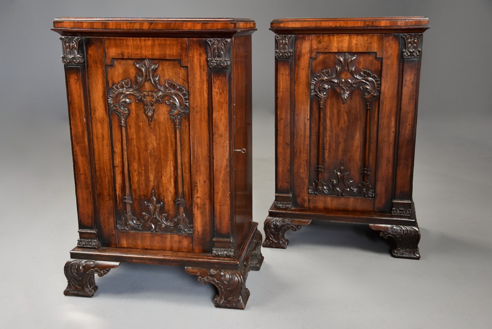 A pair of mid-18th-century mahogany Chippendale pedestal cabinets featuring relief-carved Rococo door panels, corner pilasters, and carved bracket feet. View IV