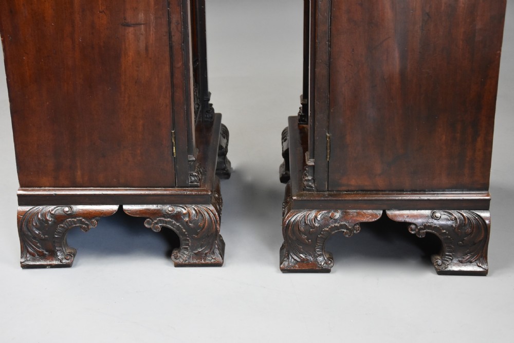 A pair of mid-18th-century mahogany Chippendale pedestal cabinets featuring relief-carved Rococo door panels, corner pilasters, and carved bracket feet. View XII
