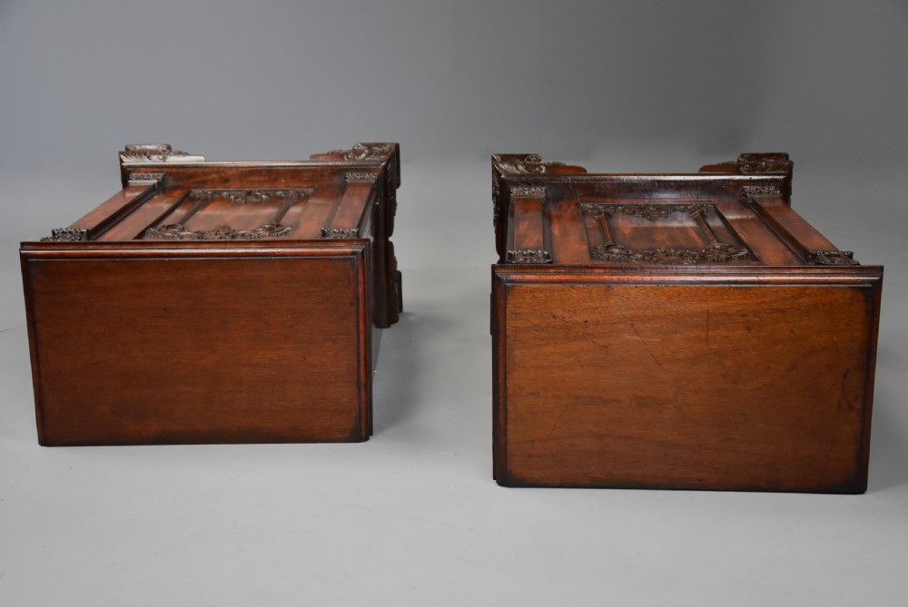 A pair of mid-18th-century mahogany Chippendale pedestal cabinets featuring relief-carved Rococo door panels, corner pilasters, and carved bracket feet. View XVI