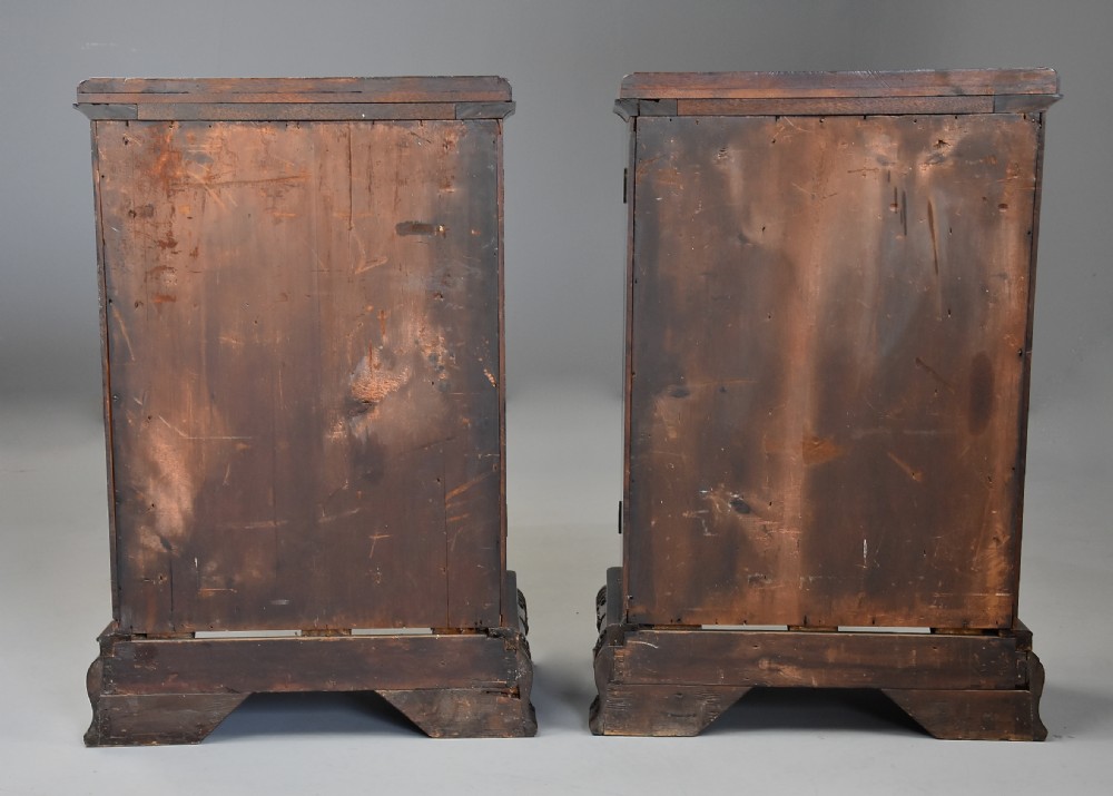 A pair of mid-18th-century mahogany Chippendale pedestal cabinets featuring relief-carved Rococo door panels, corner pilasters, and carved bracket feet. View XVII