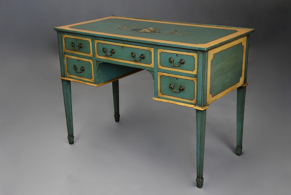 An early twentieth-century hand-painted green and gold bedroom suite featuring a wardrobe, chest of drawers with mirror, dressing desk, side tables, and caned chairs decorated with floral urn motifs. View VIII