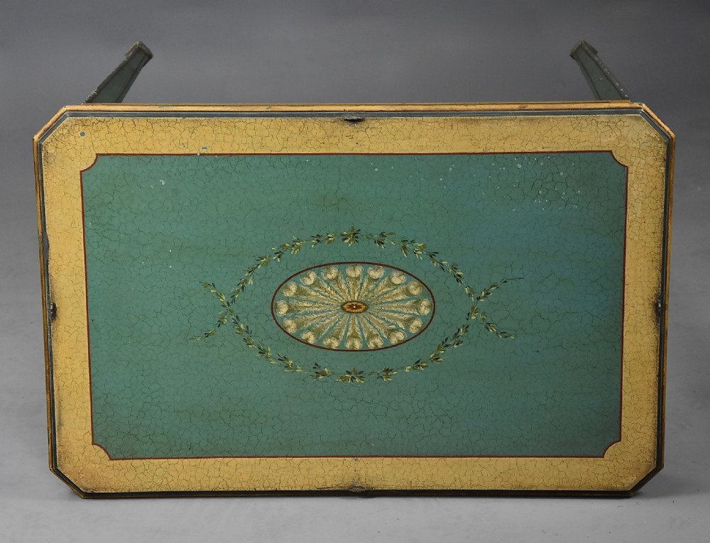 An early twentieth-century hand-painted green and gold bedroom suite featuring a wardrobe, chest of drawers with mirror, dressing desk, side tables, and caned chairs decorated with floral urn motifs. View XV