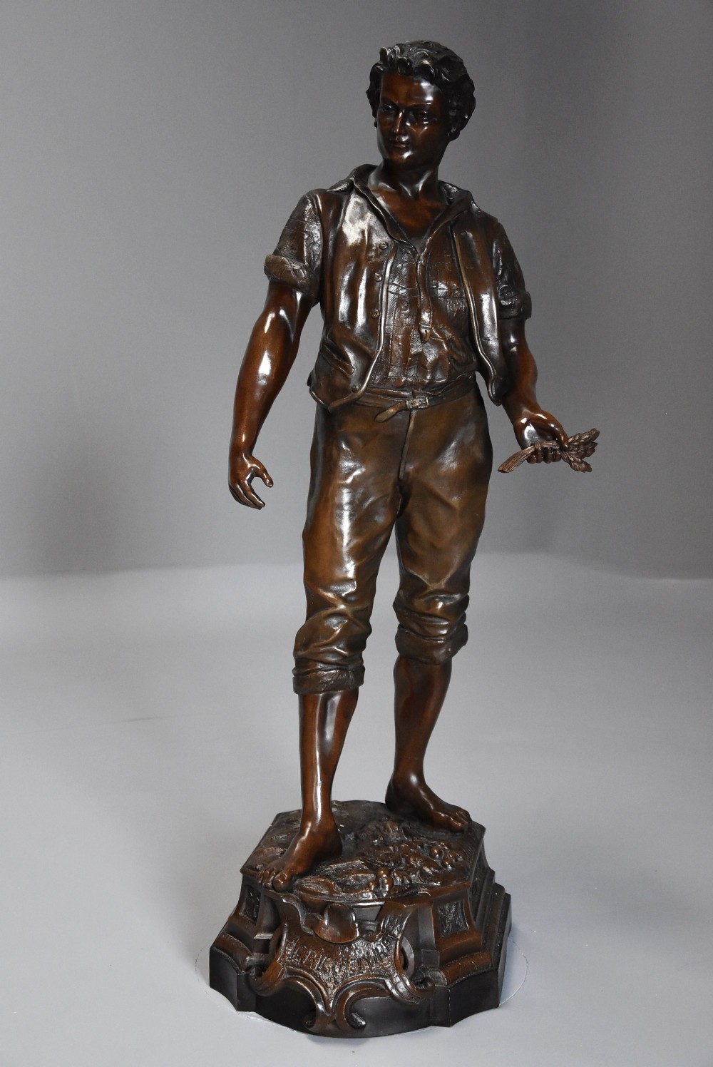 Large late 19thc French bronzed spelter figure of a farm labourer, signed F.Milliot