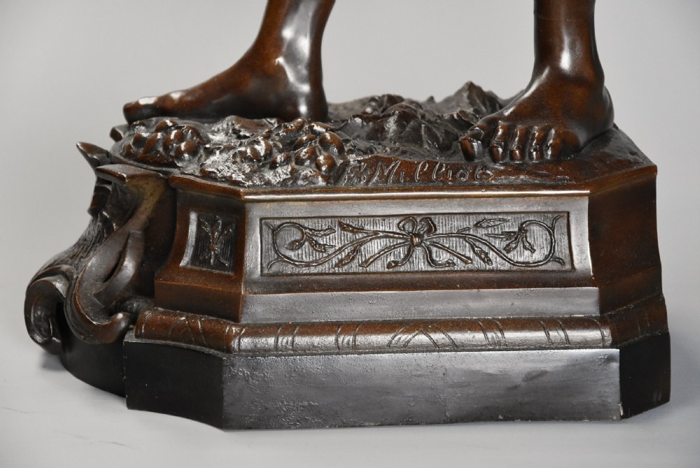 A late 19th-century French bronzed spelter figure depicting a barefoot male farm labourer holding a small bundle of wheat on a moulded base. View XIII