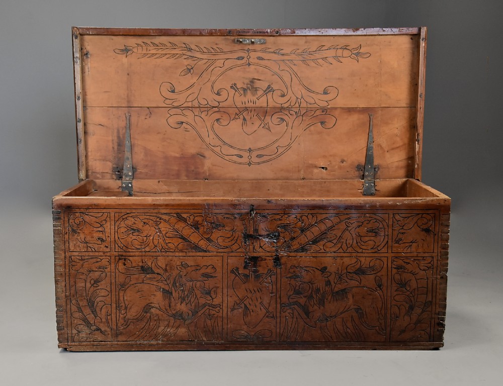Early seventeenth-century Northern Italian cypress wood coffer decorated with detailed incised panels depicting mythical beasts and heraldic symbols. View VII