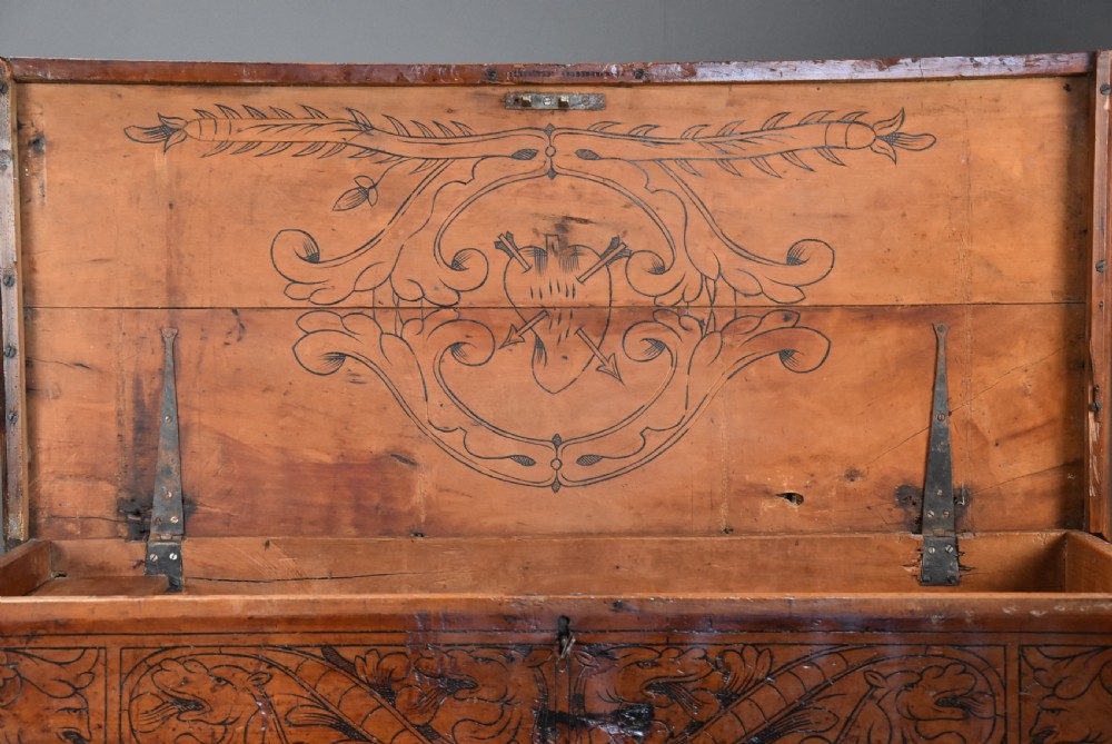 Early seventeenth-century Northern Italian cypress wood coffer decorated with detailed incised panels depicting mythical beasts and heraldic symbols. View VIII
