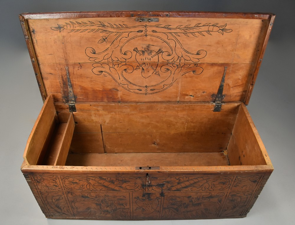 Early seventeenth-century Northern Italian cypress wood coffer decorated with detailed incised panels depicting mythical beasts and heraldic symbols. View IX