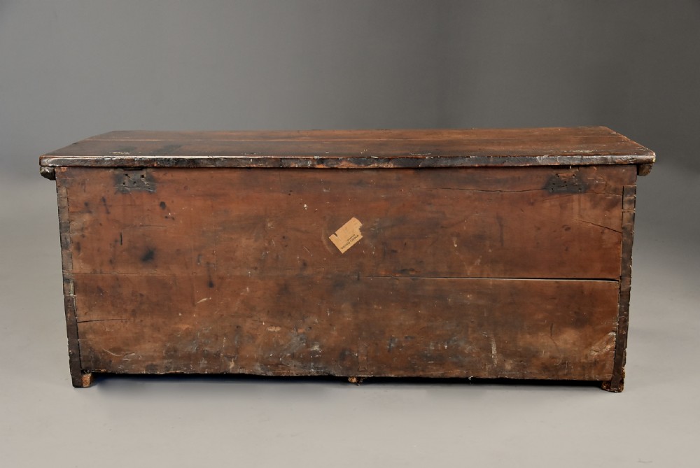 Early seventeenth-century Northern Italian cypress wood coffer decorated with detailed incised panels depicting mythical beasts and heraldic symbols. View XIV