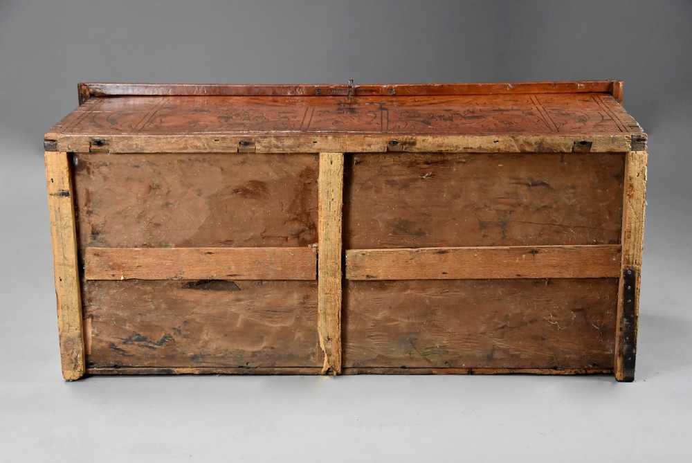 Early seventeenth-century Northern Italian cypress wood coffer decorated with detailed incised panels depicting mythical beasts and heraldic symbols. View XV