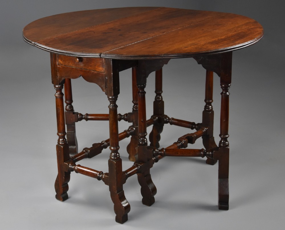 Rare 18thc red walnut gateleg table of small proportions and fine patina