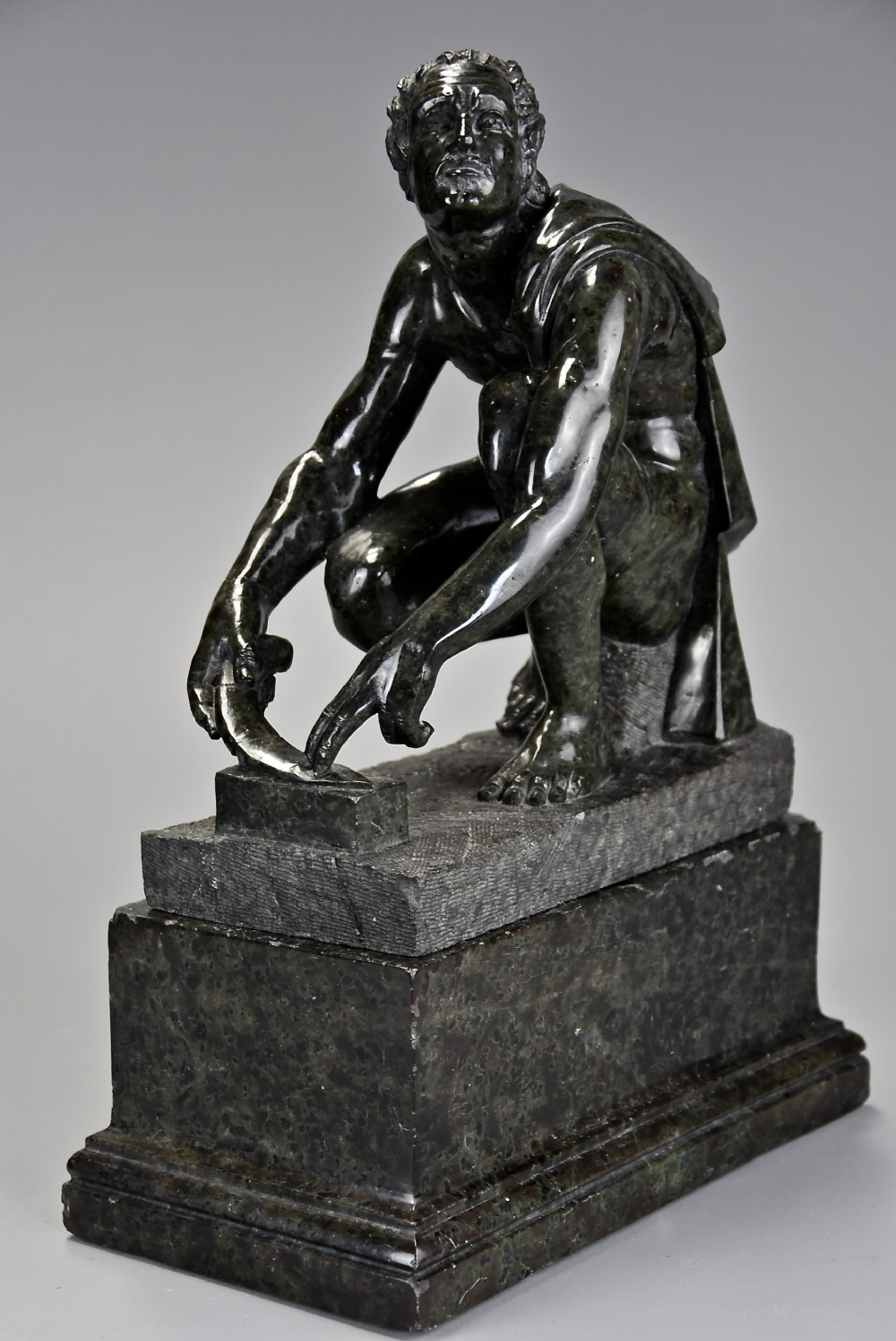Finely carved Italian Grand Tour verdo prato figure of ‘Arrotino’ or ‘The Knife Sharpener’
