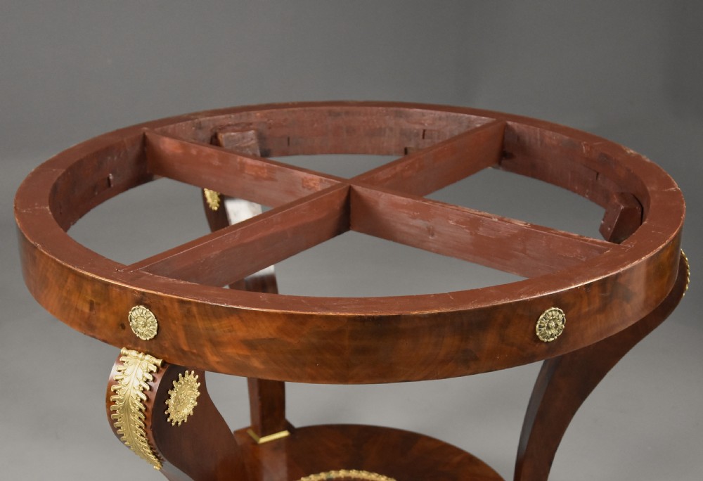 A late 19th-century French Empire style circular gueridon table featuring a grey marble top, mahogany frame with gilded bronze mounts, and curved legs with paw feet. View XII