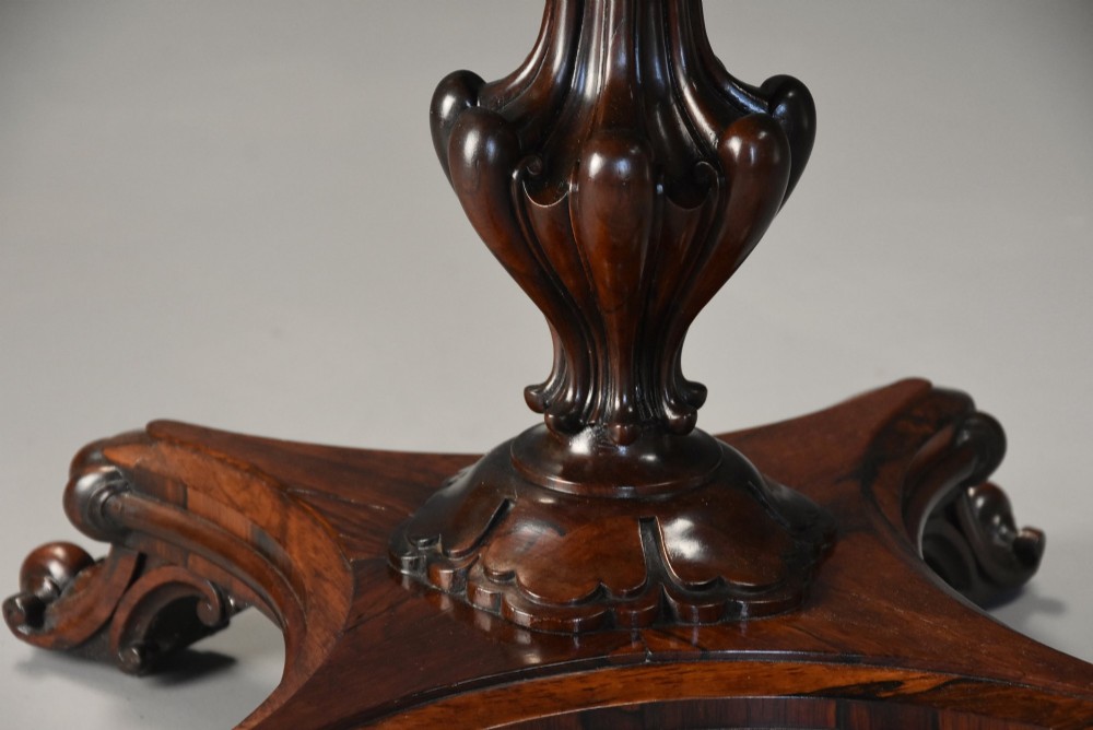 A mid-19th century rosewood games table featuring a square specimen marble inlaid chessboard top resting on a carved pedestal stem and scroll feet. View VII