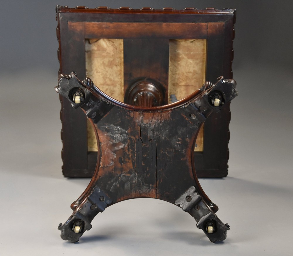 A mid-19th century rosewood games table featuring a square specimen marble inlaid chessboard top resting on a carved pedestal stem and scroll feet. View X