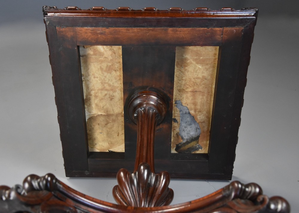 A mid-19th century rosewood games table featuring a square specimen marble inlaid chessboard top resting on a carved pedestal stem and scroll feet. View XI
