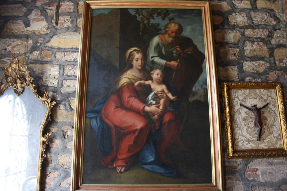 An 18th-century oil painting on canvas depicting the Holy Family set in a narrow gilded wooden frame. View III