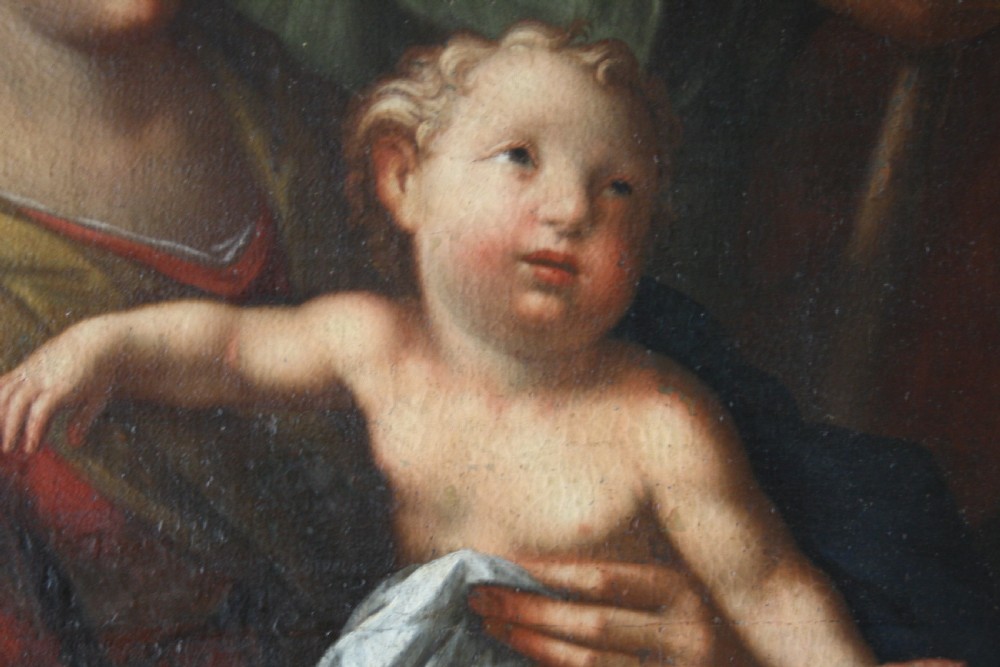 An 18th-century oil painting on canvas depicting the Holy Family set in a narrow gilded wooden frame. View VIII