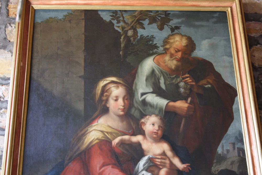 An 18th-century oil painting on canvas depicting the Holy Family set in a narrow gilded wooden frame. View XI