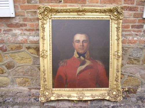 fig 8. OIL PORTRAIT PAINTING MANNER OF SIR THOMAS LAWRENCE OF A BRITISH ARMY OFFICER IN HIS RED COAT TUNIC UNIFORM DATING (1795-1802) LATE 18TH-EARLY 19TH CENTURY ENGLISH SCHOOL IN A MAGNIFICENT DECORATIVE GILT-WOOD FRAME 35 X 40 INCHES