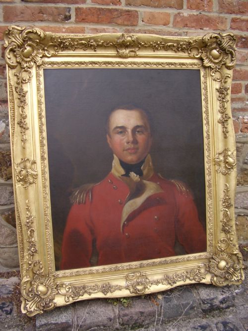 fig 4. OIL PORTRAIT PAINTING MANNER OF SIR THOMAS LAWRENCE OF A BRITISH ARMY OFFICER IN HIS RED COAT TUNIC UNIFORM DATING (1795-1802) LATE 18TH-EARLY 19TH CENTURY ENGLISH SCHOOL IN A MAGNIFICENT DECORATIVE GILT-WOOD FRAME 35 X 40 INCHES