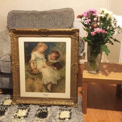 fig 4. An antique framed colour print titled Sweethearts after Frederick Morgan, depicting two children sitting outdoors within an ornate gilded frame.