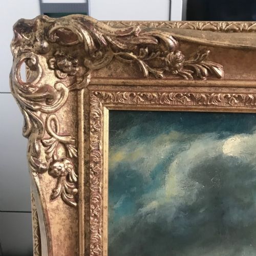 fig 7. An eighteenth-century style double oil portrait featuring a seated couple in period costume framed in an ornate gilded frame.