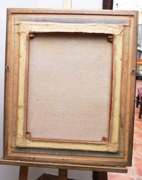 fig 1. A portrait oil painting depicting a lady in a black lace mantilla set within a moulded gilt wood frame.