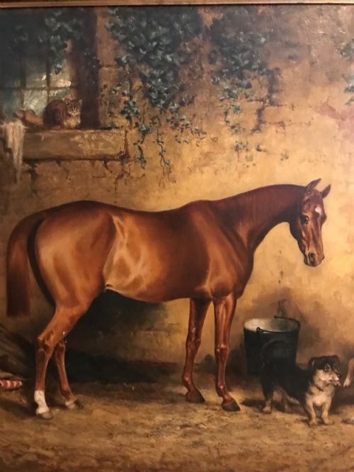fig 5. A 19th-century oil painting depicting a bay horse alongside two dogs in a stone stable yard, set within a heavily carved gilt frame.
