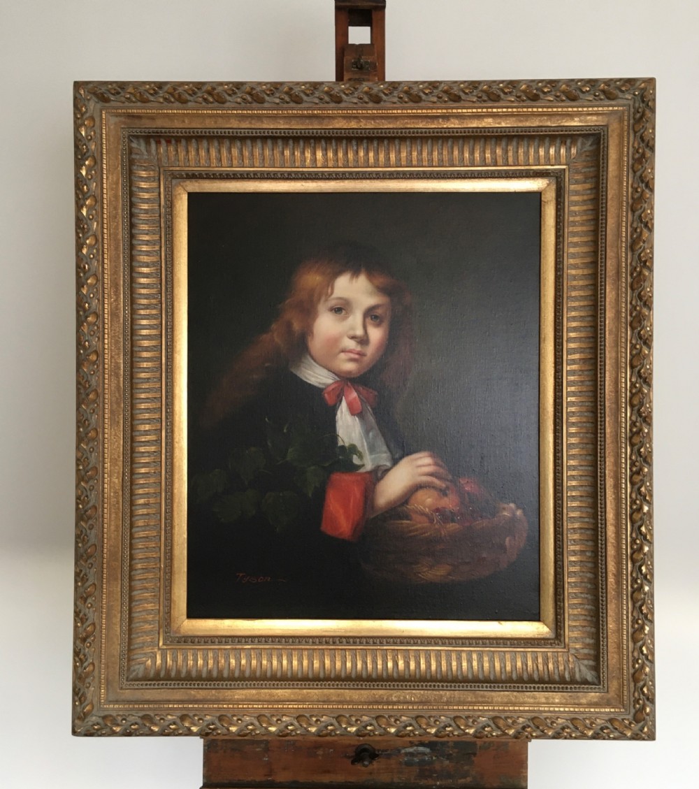 A framed portrait painting of a young boy holding a fruit basket, presented inside a carved gilded wood frame. View VI