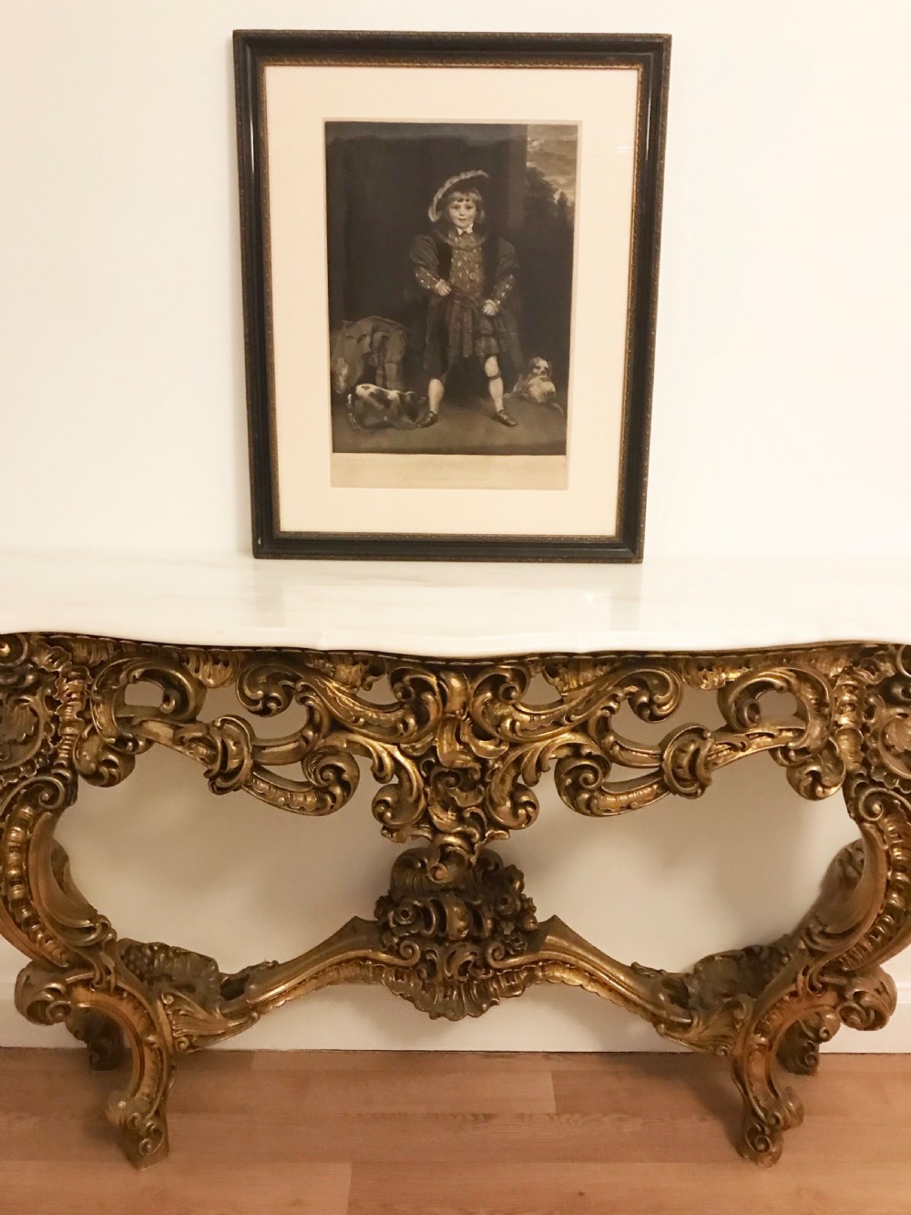 A framed black and white mezzotint print depicting a young boy in historical dress posing as Henry VIII.