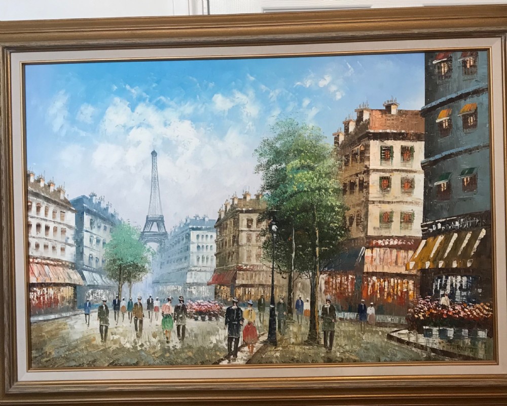 A large framed impressionist oil painting depicting a Parisian street scene with people walking towards the Eiffel Tower under a blue sky. View XI