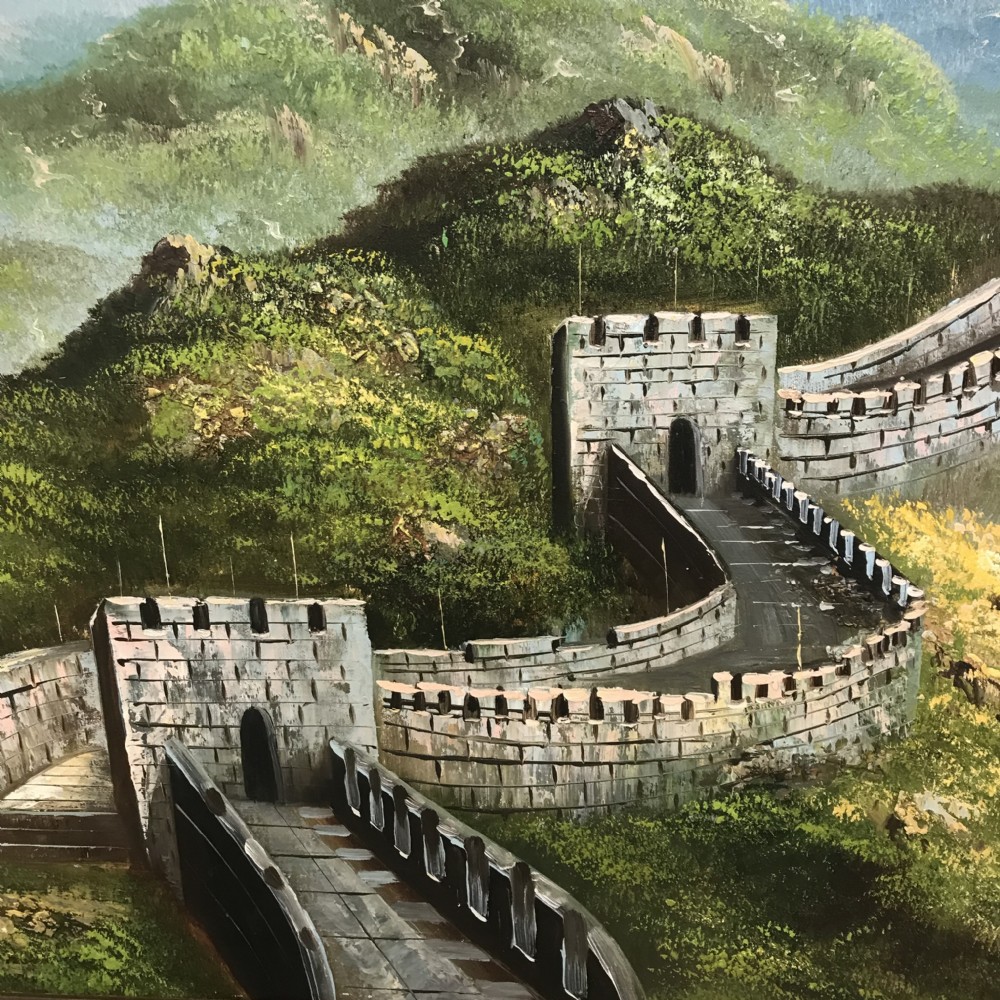 A large horizontal oil painting depicting the Great Wall of China winding through lush green mountains under a cloudy sky, encased in a metallic green and gold frame. View V