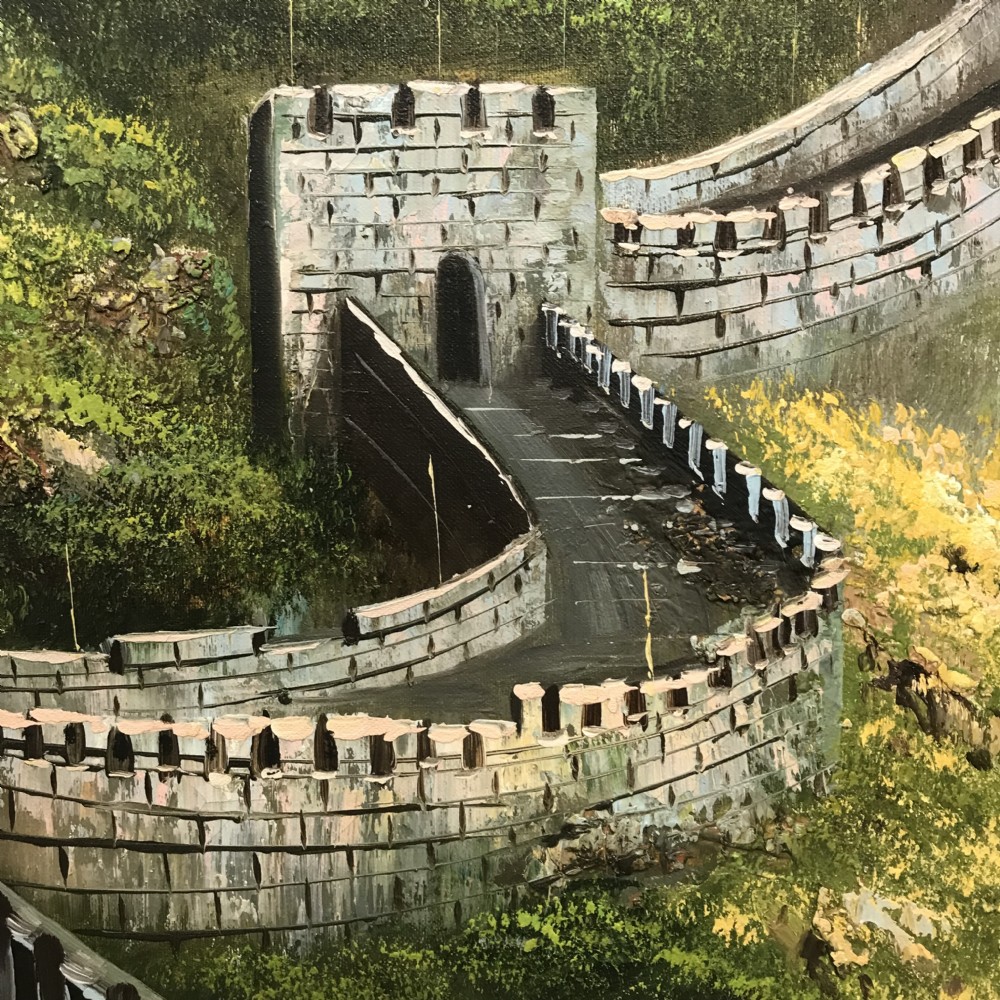 A large horizontal oil painting depicting the Great Wall of China winding through lush green mountains under a cloudy sky, encased in a metallic green and gold frame. View XVI