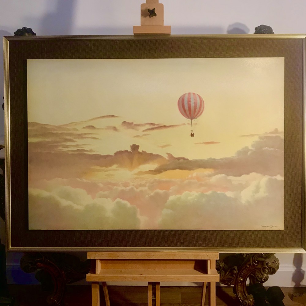 A large horizontal lithograph depicting a red and white striped hot air balloon floating above golden sunset clouds. View V