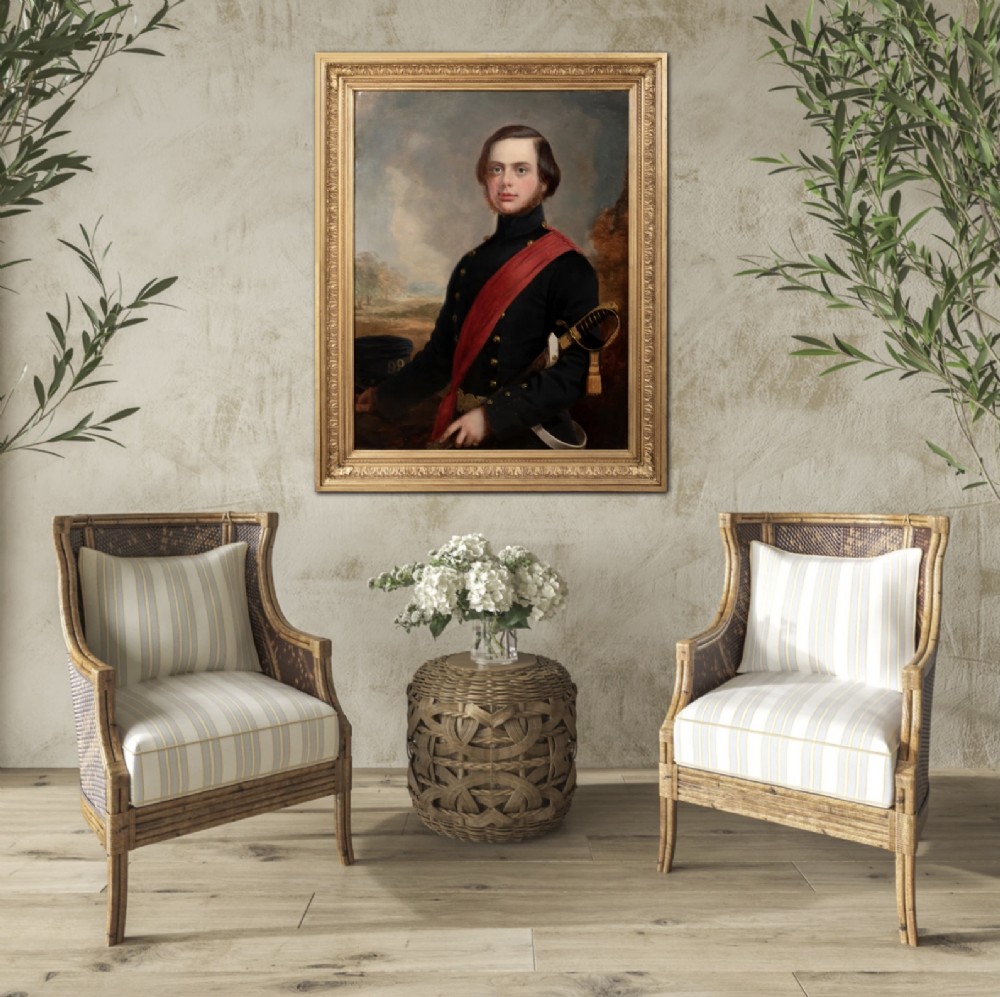 A nineteenth-century oil portrait on canvas depicting a British military officer in a dark tunic with a red sash, framed in an ornate gilt wood frame.