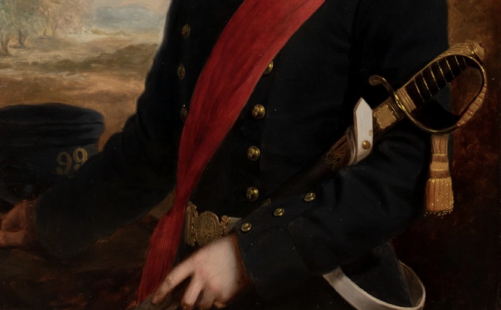 A nineteenth-century oil portrait on canvas depicting a British military officer in a dark tunic with a red sash, framed in an ornate gilt wood frame. View VI