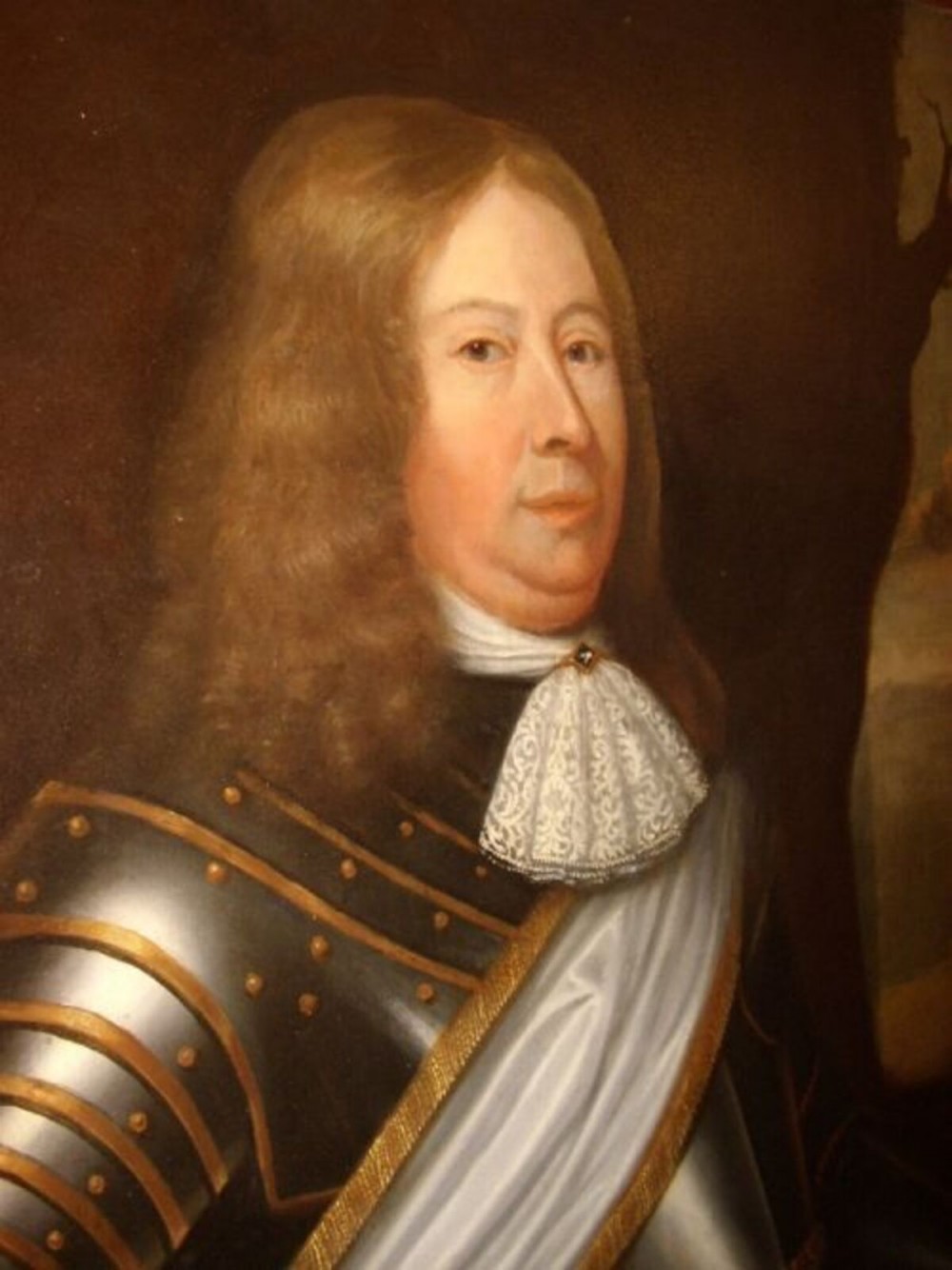 A seventeenth-century oil painting portraying a gentleman in plate armour with a lace cravat, set within an ornate gilded frame. View V