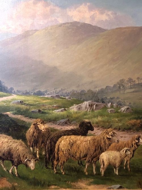 A 19th-century oil painting depicting a flock of sheep on a grassy hillside path with distant mountains, housed in a carved giltwood frame. View II