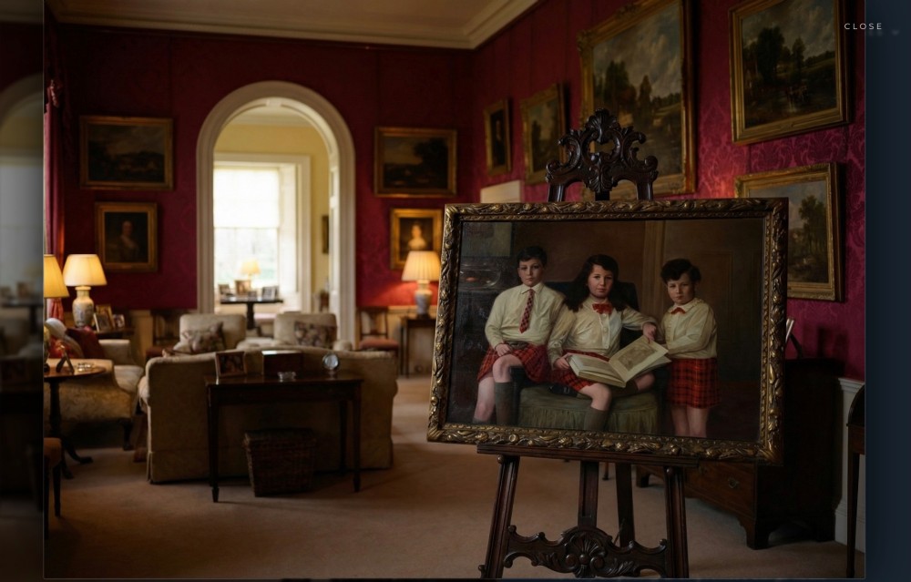 A large framed oil painting depicting three children seated together wearing red tartan kilts within a carved gilded frame. View XIV