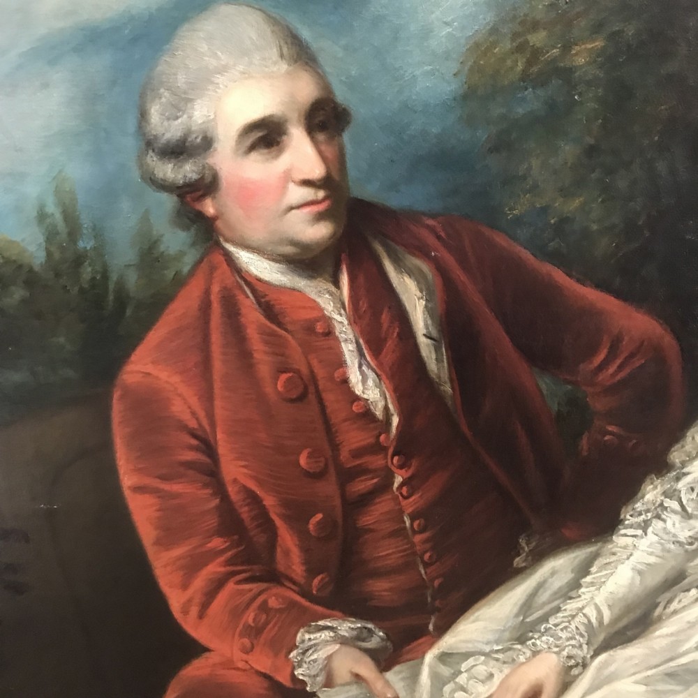 An 18th-century style oil painting depicting a seated man in a red velvet coat and a woman in an ivory gown, set in a carved gilt frame. View VIII