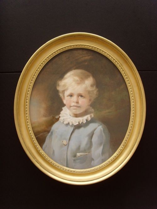 A nineteenth-century pastel portrait of a young boy with blonde hair wearing a light blue coat with a ruffled white collar. View X