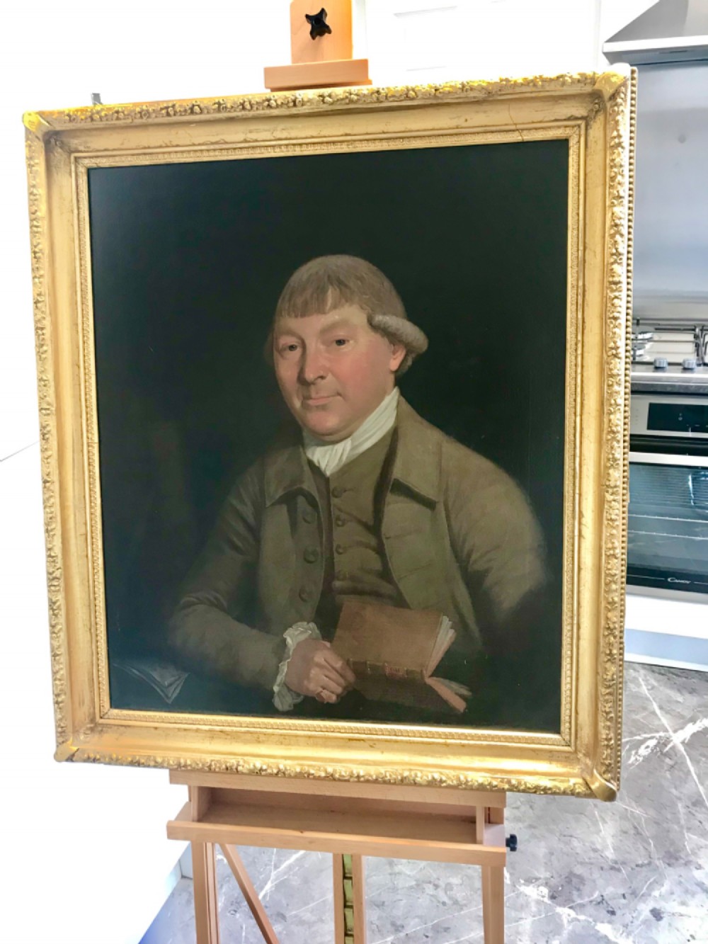 An 18th-century oil portrait depicting a male medical physician rendered in rich dark tones on canvas. View V