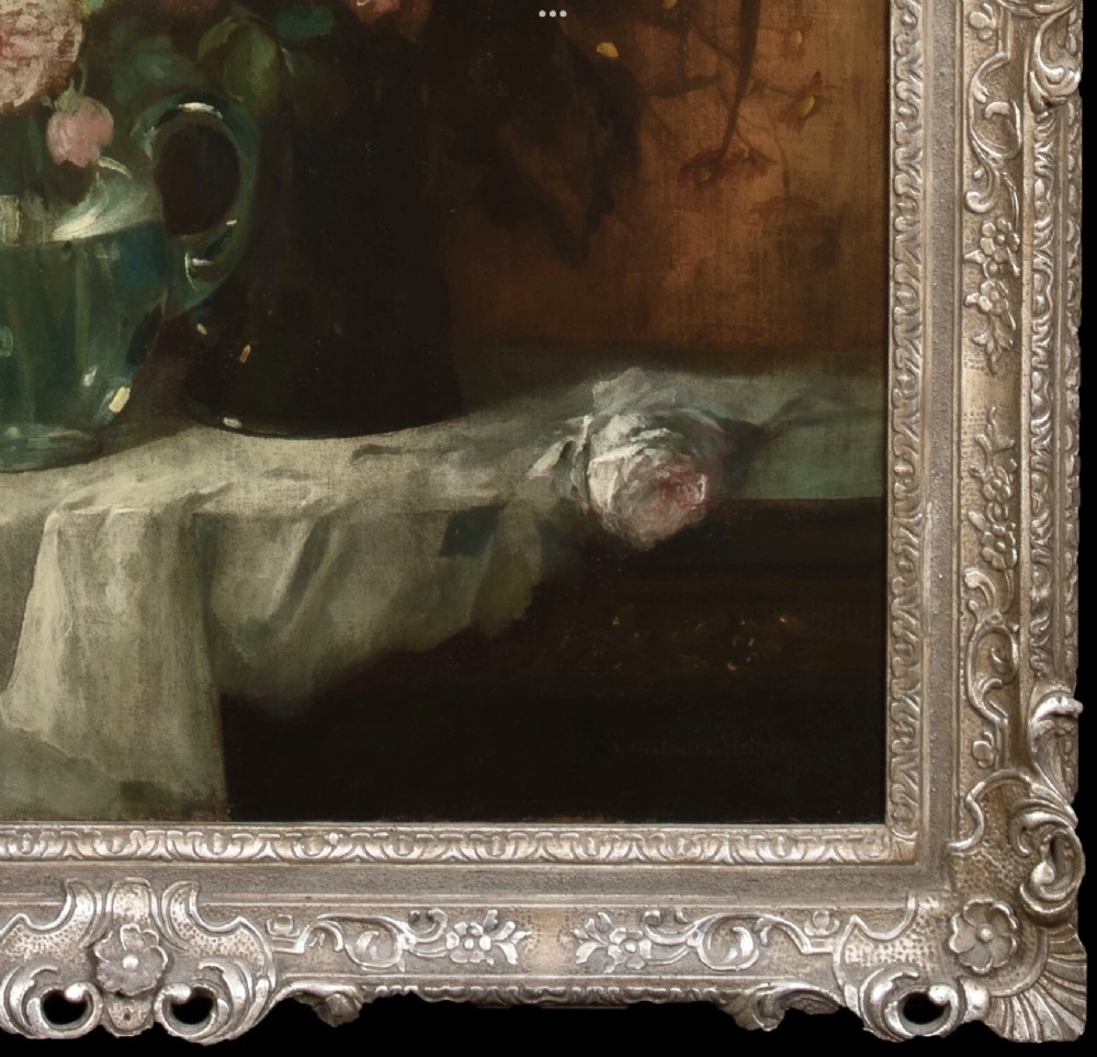 A 19th-century oil painting on canvas featuring a prominent vase of white and pink flowers on a draped tablecloth, set within an ornate silvered carved frame. View XI