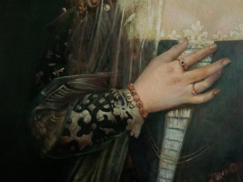 A framed oil portrait depicting a Venetian noblewoman wearing a dark gown, pearl necklace, and transparent veil, presented in a moulded gilded frame. View III