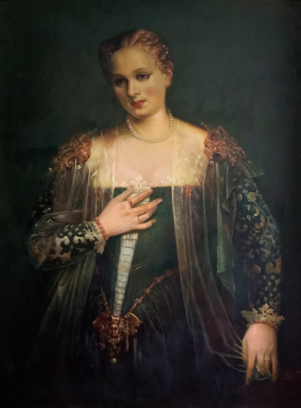 A framed oil portrait depicting a Venetian noblewoman wearing a dark gown, pearl necklace, and transparent veil, presented in a moulded gilded frame. View V
