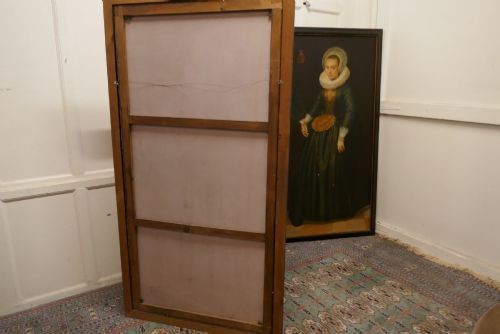 A pair of large framed full-length oil portraits depicting a man and woman in 17th-century Dutch attire with white ruff collars. View IV