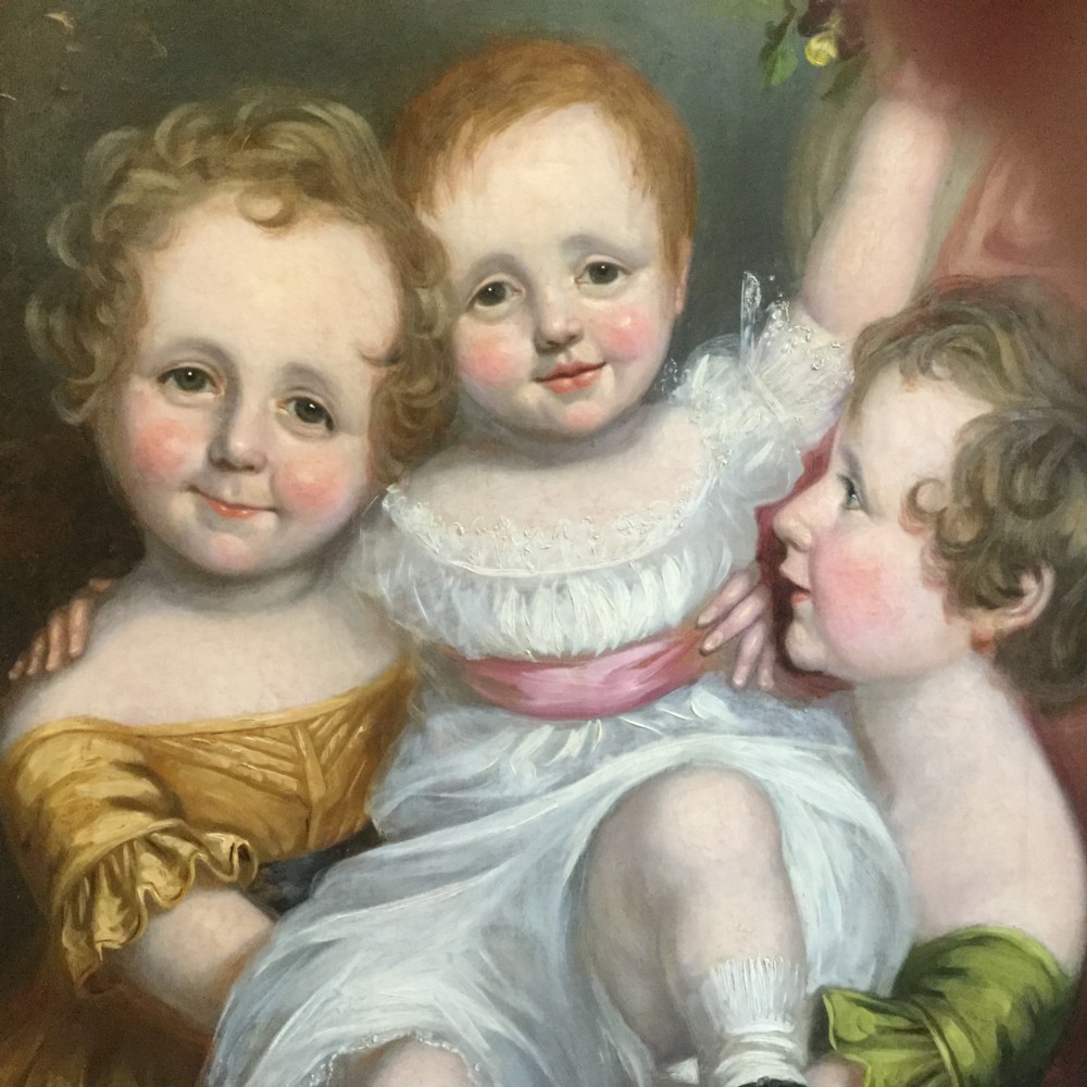 A 19th-century oil portrait of three children in classical attire contained within a carved swept giltwood frame. View III