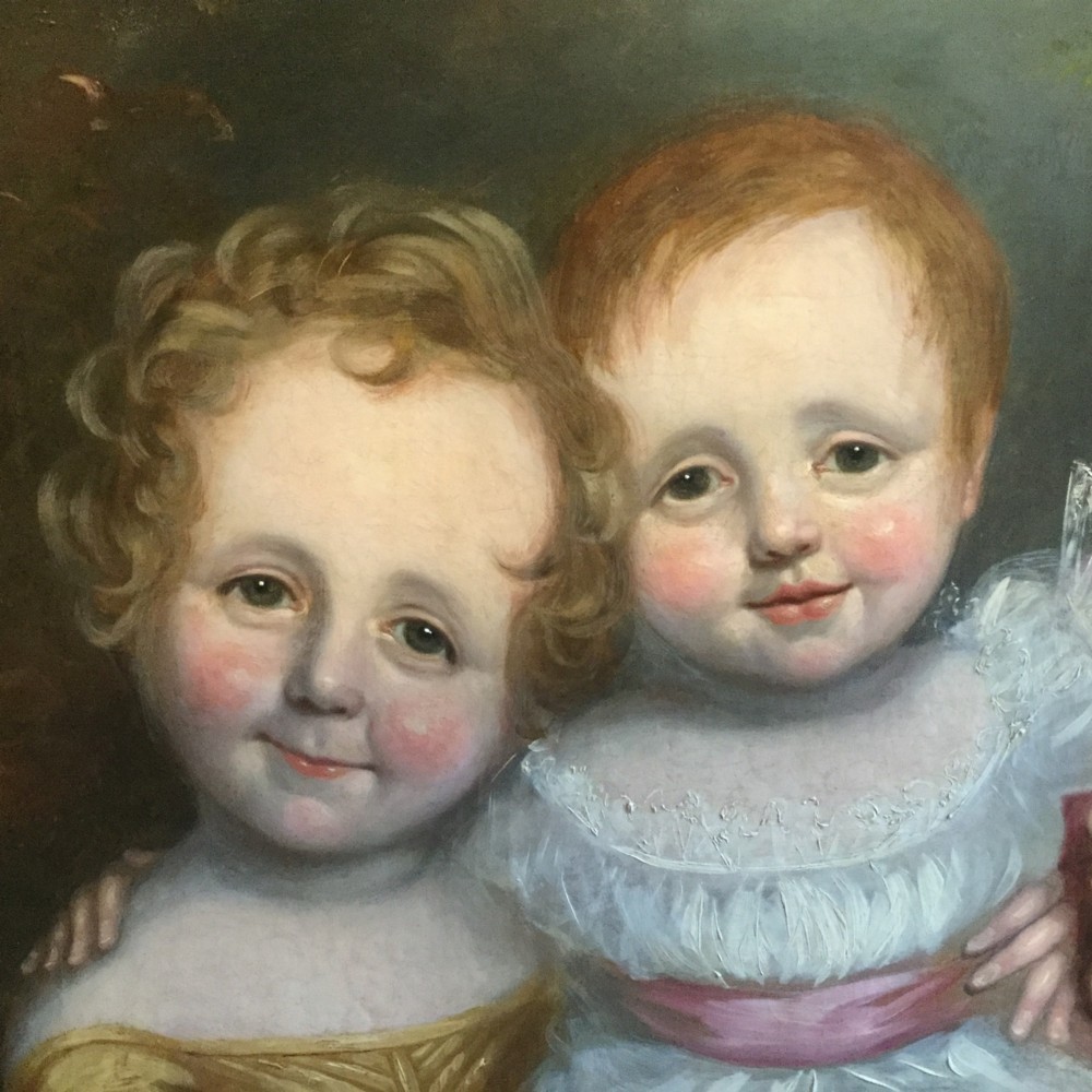 A 19th-century oil portrait of three children in classical attire contained within a carved swept giltwood frame. View V