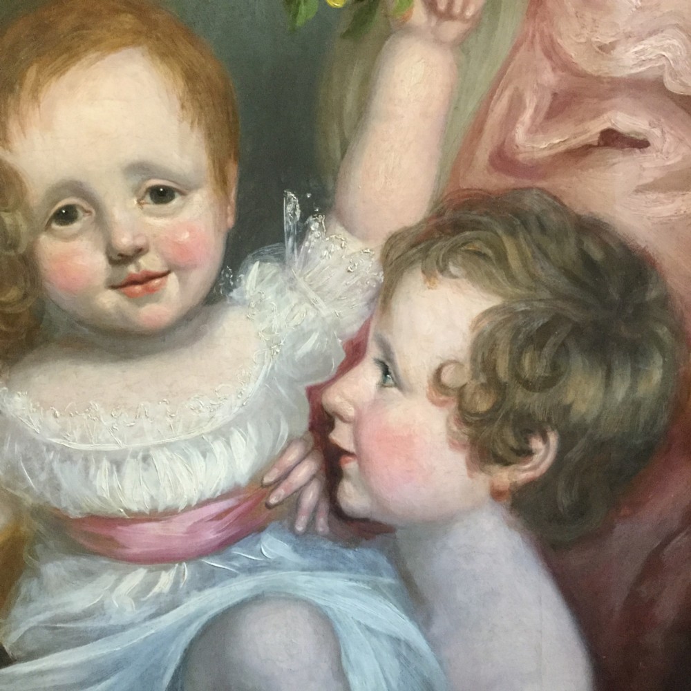 A 19th-century oil portrait of three children in classical attire contained within a carved swept giltwood frame. View VI