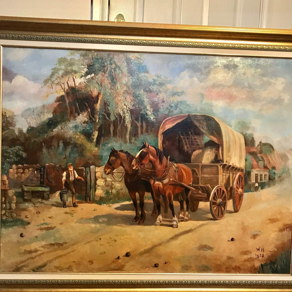 A framed oil painting depicting two brown draught horses harnessed to a covered wagon along a rural dirt road near cottages and trees. View XIV